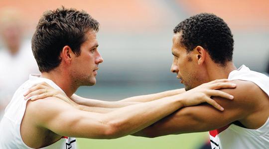 Rio Ferdinand (right) trains with Michael Owen.