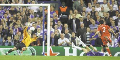 Chelsea`s Joe Cole (grounded) hits the ball past goalkeeper Pepe Reina during yesterday`s Champions League semi-final, first leg, at Stamford Bridge.