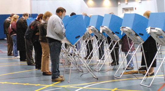 File photo: Voters stand at computer voting machines as they cast their ballots for the midterm elections at the Grace Baptist Church in Cedarville, Ohio. In the US in 2000, a ballot fiasco in Florida delayed the result of the Presidential election by 35 days.