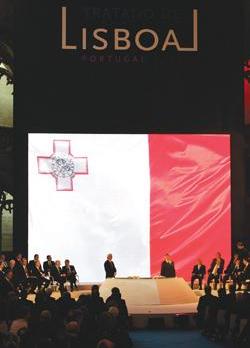 The Maltese flag displayed as Prime Minister Lawrence Gonzi makes his way to the head table to formally sign the Lisbon Treaty on December 13, 2007.