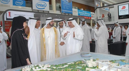 Sheikh Mohammed bin Rashid Al Maktoum, Vice President of the United Arab Emirates and Prime Minister and Ruler of Dubai (fourth from left) with Fareed Abdulrahman, SmartCity CEO (centre), showing the SmartCity Malta model, at Gitex 2008.