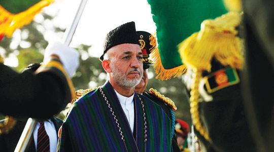 Afghan President Hamid Karzai during Independence Day celebrations at the Defence Ministry compound in Kabul, yesterday.
