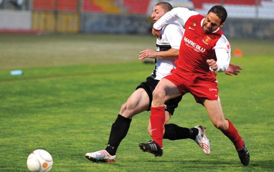 Big push... Valletta's Kenneth Scicluna (right) and Terrence Scerri, of Hibs, in a tussle for possession.