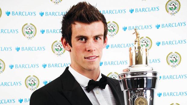 Gareth Bale holds the PFA Player of the Year trophy.